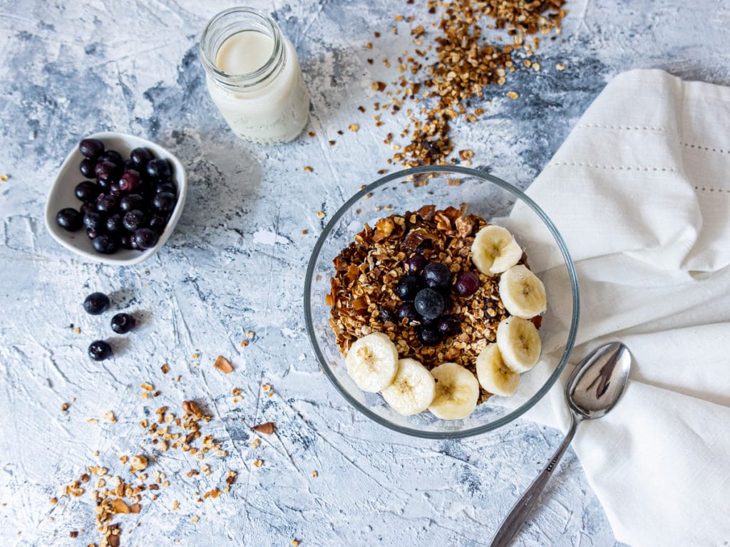 Bowl of granola and glass of milk 