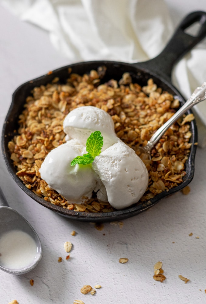 Close up of peach crisp with ice cream 