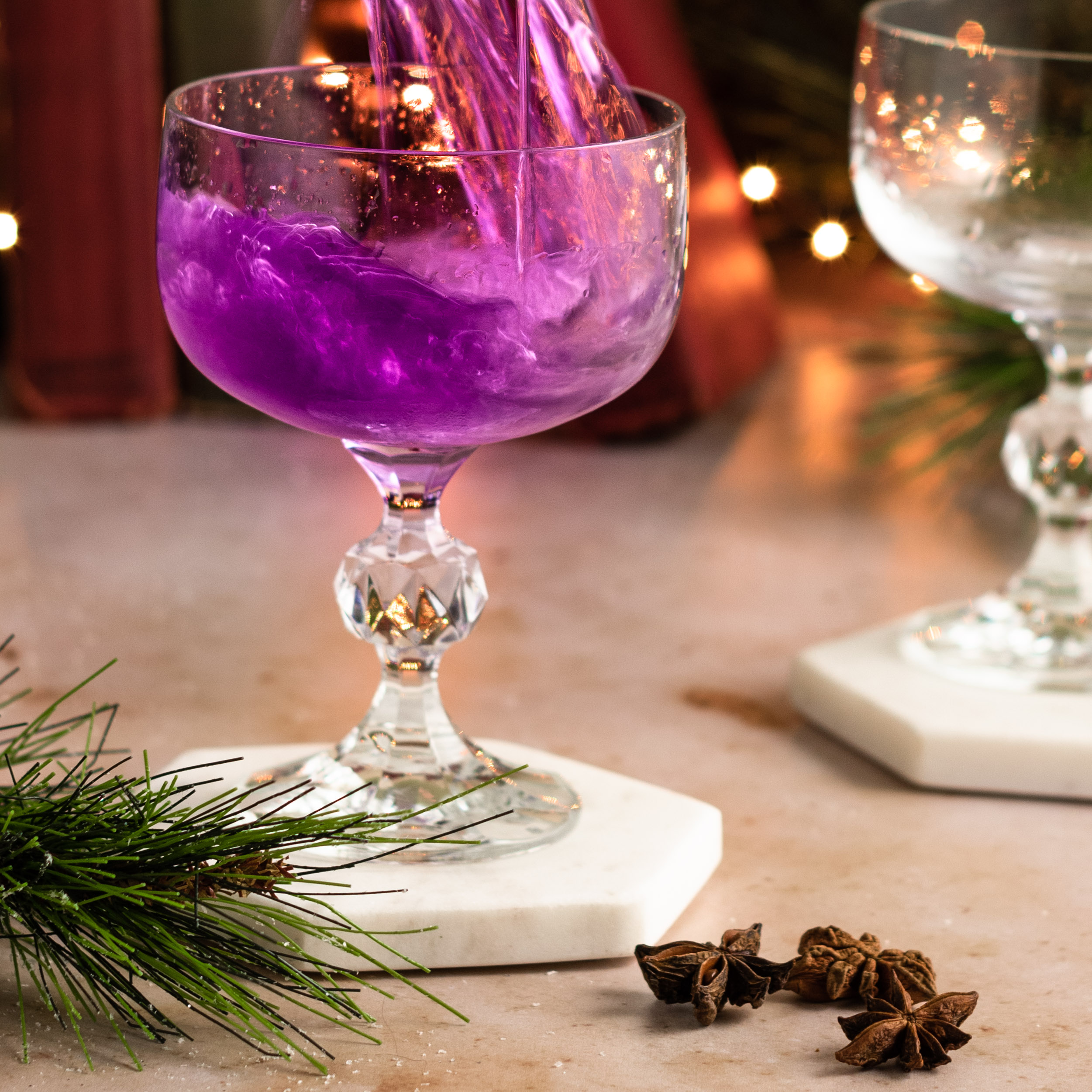 Pouring the purple coktail in to the glass