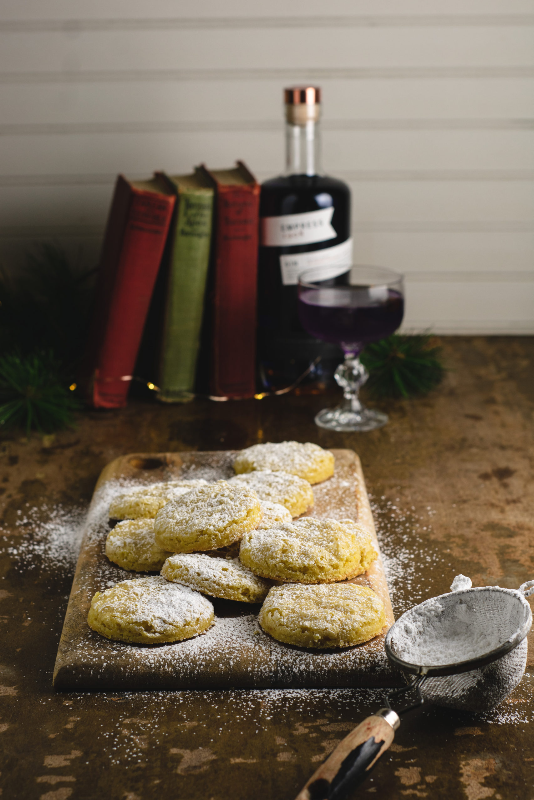 holiday table of orange sugar cookies and a cocktail 