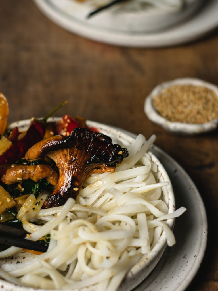 Close up of grilled chanterlle in this spicy mushroom and noodle stir fry.