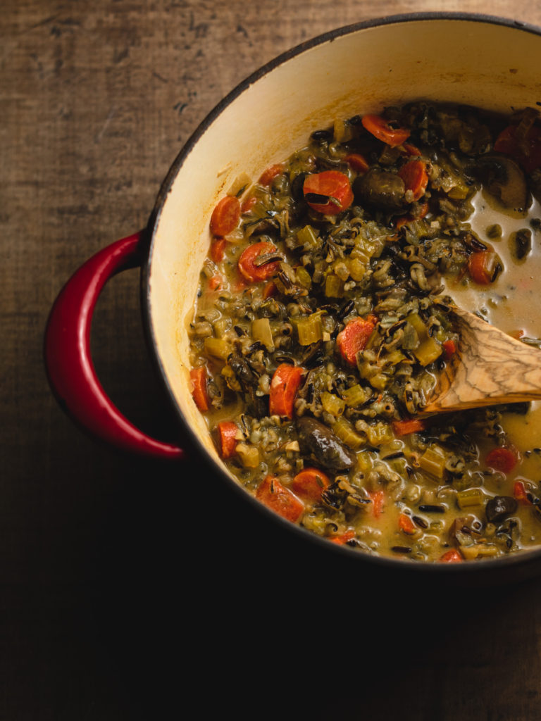 vegan wild rice mushroom soup cooking in a pot