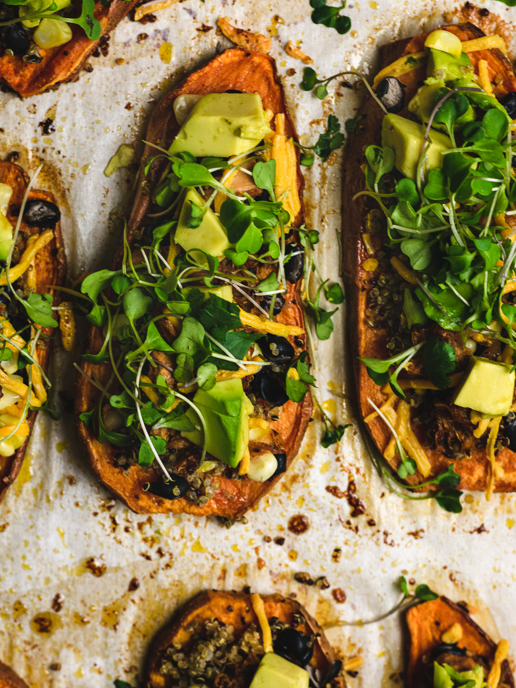 close up of sweet potatoes with healthy topping like jackfruit and microgreens making it a great vegan appitizer