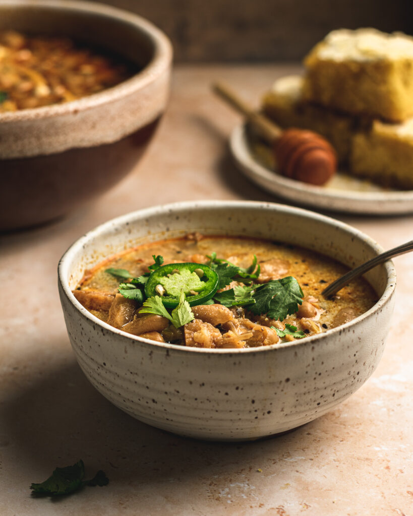 Bowl of white bean chili made with jackfruit.